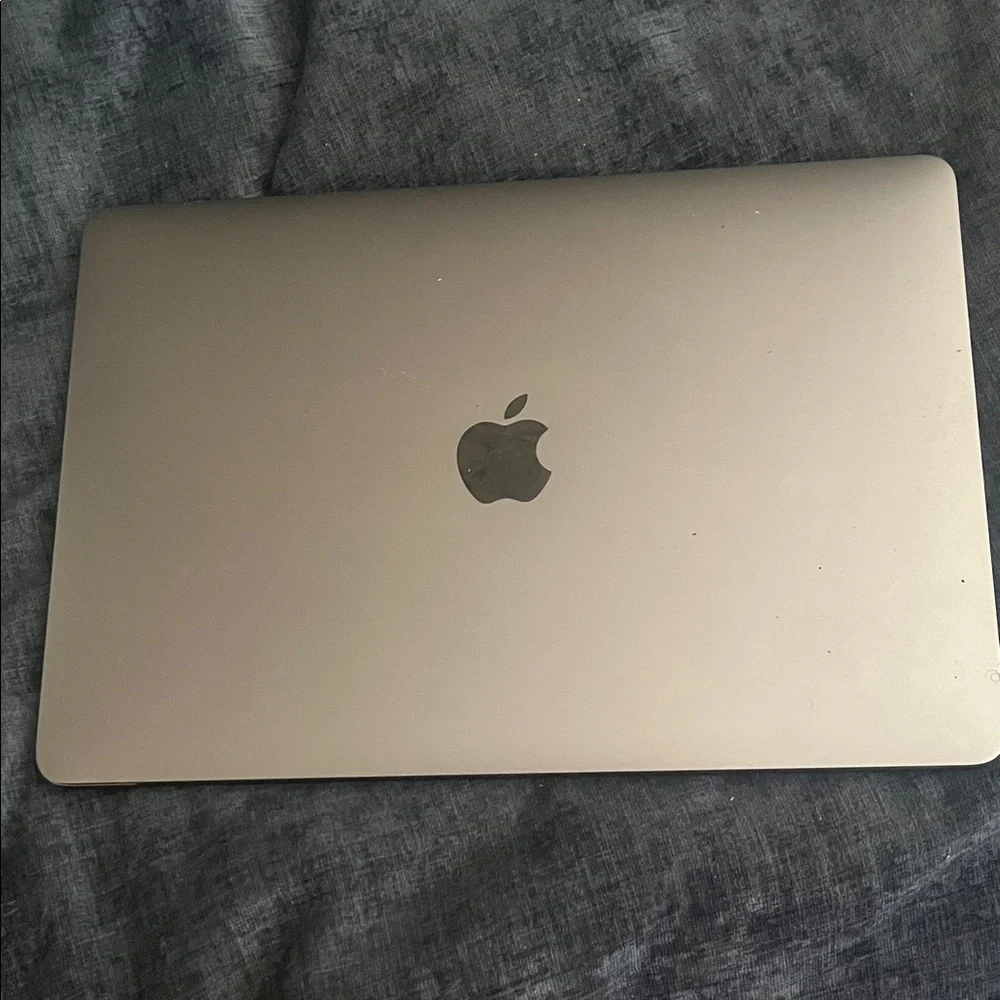 Apple MacBook in Sleek Silver - Picture 1 of 2